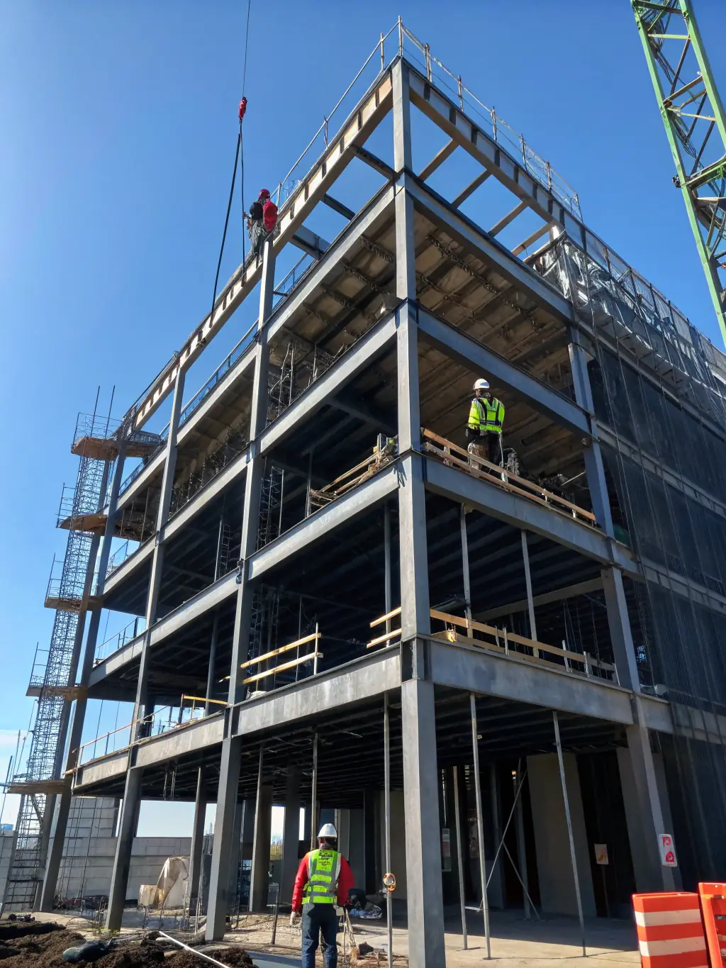 A high-rise building under construction in Manchester, symbolizing urban development and investment opportunities.